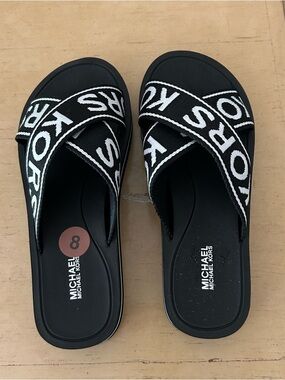 Michael Michael Kors black and white slide sandals in size 8